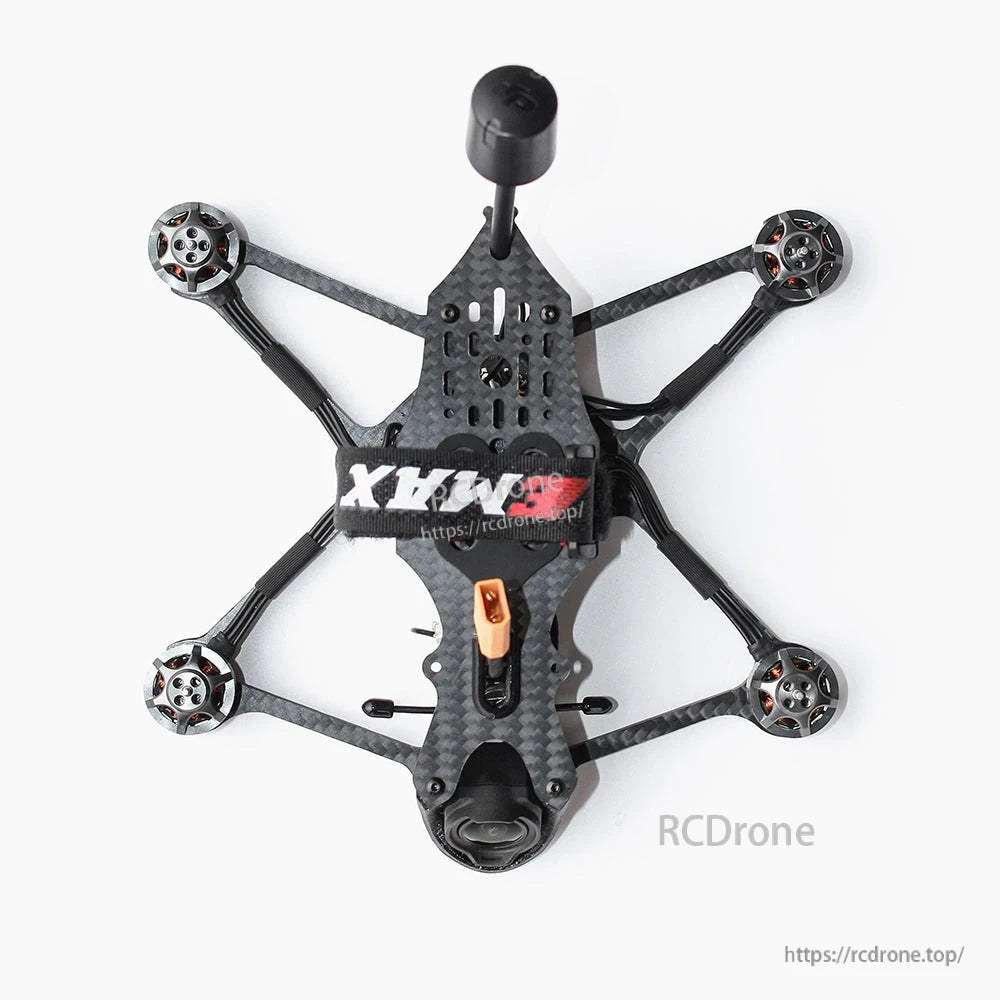 Top-down view of carbon fiber frame layout with four motors, antenna, battery strap and camera