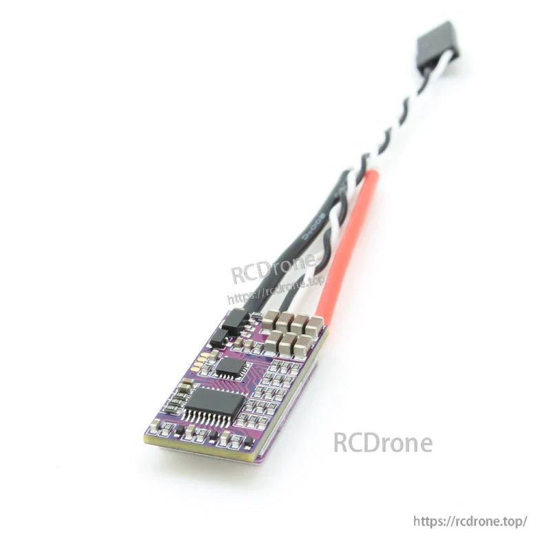 Bottom side of ESC PCB showing electronic components and capacitor bank with attached power leads