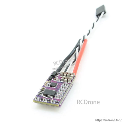 Bottom side of ESC PCB showing electronic components and capacitor bank with attached power leads