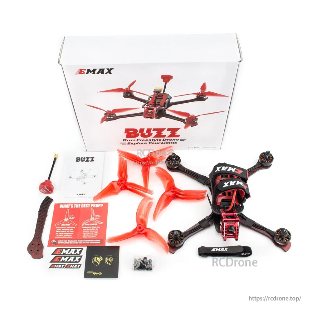 EMAX Buzz kit package contents: retail box, drone, spare props, antenna, stickers, and hardware