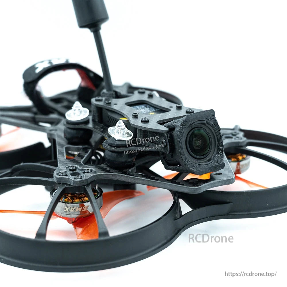 Close-up of front FPV camera lens and carbon frame inside ducted prop guard