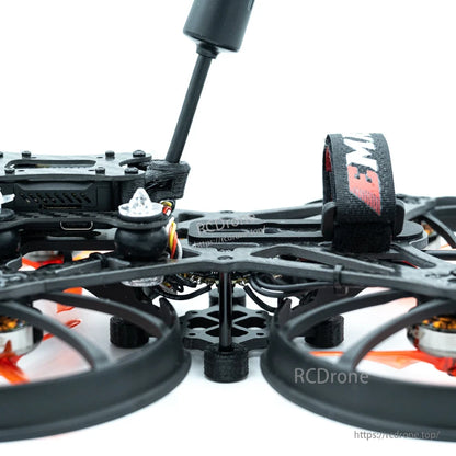 Low profile side view showing antenna mast, battery strap, and landing standoffs under frame
