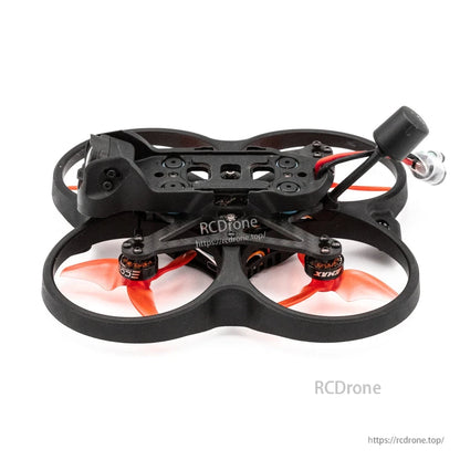 Low rear-side view of ducted quad frame showing motor pods, wiring, and battery lead at the back