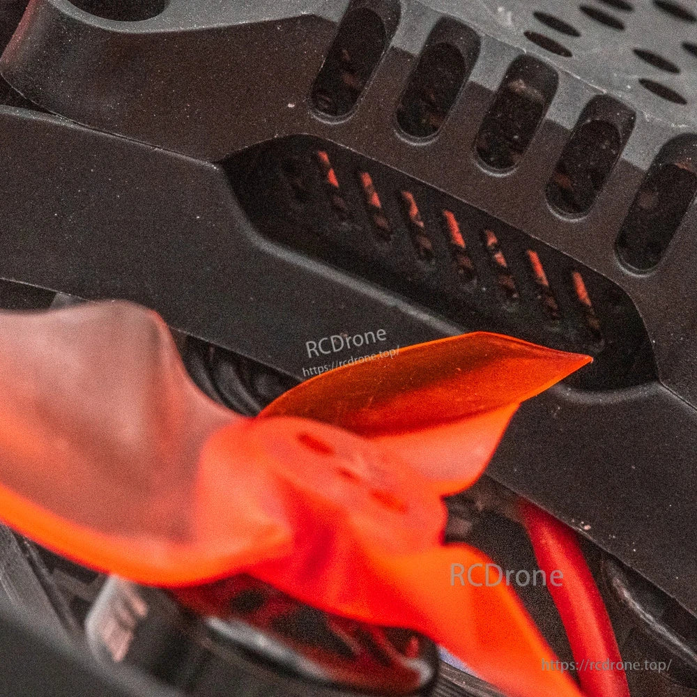 Close-up of Cinehawk Mini frame canopy vents and orange prop blade near the duct opening