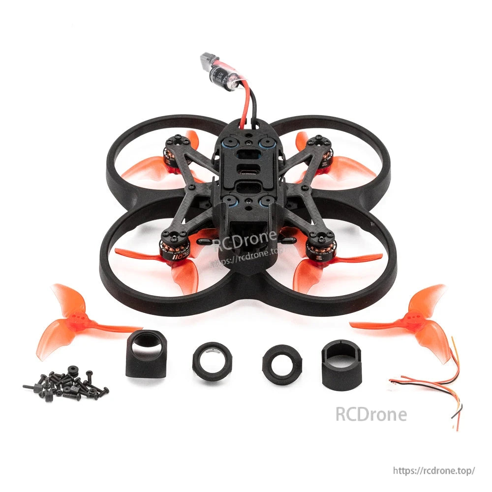 EMAX Cinehawk Mini 2.5-inch drone kit layout with spare props, mounting parts, screws, and wires