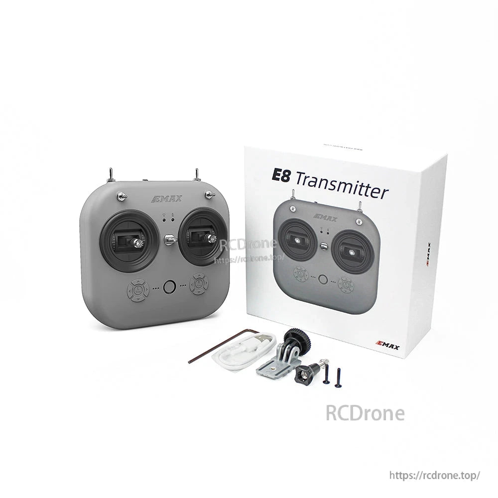 EMAX E8 transmitter packaging with included accessories laid out (transmitter view obscured)