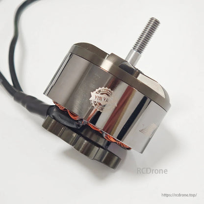 EMAX ECOII-4720 brushless motor angled side view showing threaded shaft, bell housing, and base