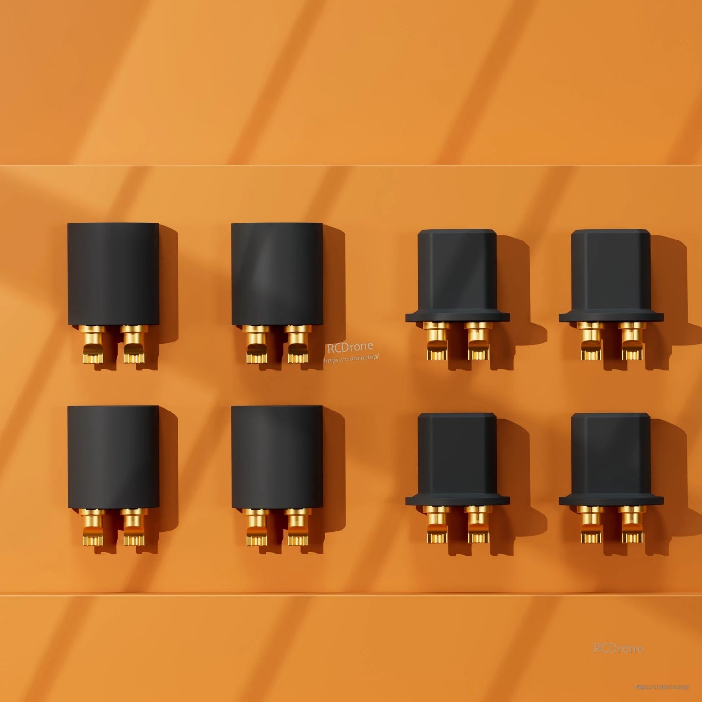 Grid layout of black power connectors with gold pins on orange background, top-down view