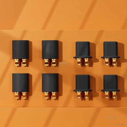 Grid layout of black power connectors with gold pins on orange background, top-down view