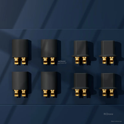 Multiple black micro power connectors with gold pins arranged in a grid on dark blue background