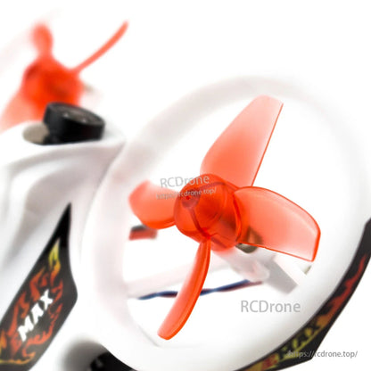 Close-up of orange tri-blade propeller inside white duct guard on the micro quad