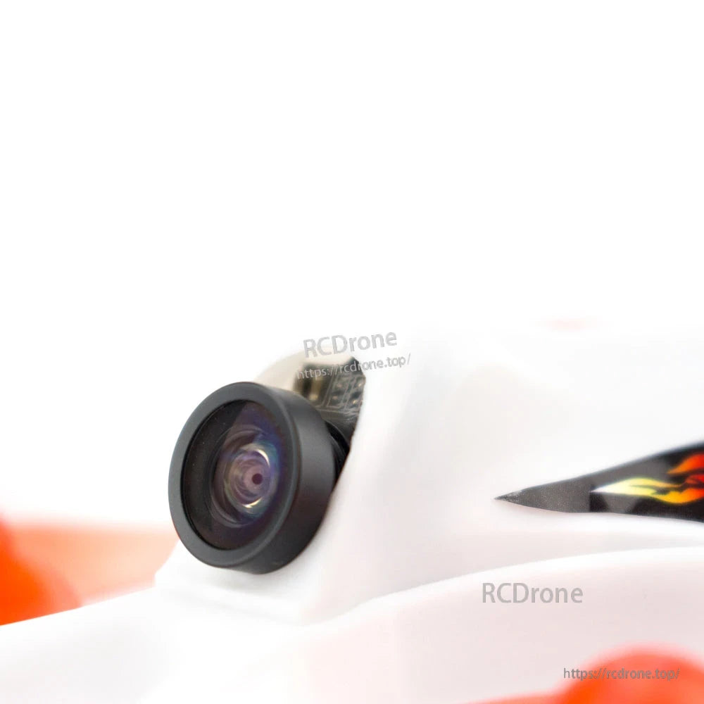 Close-up of the micro FPV camera lens mounted in the white canopy