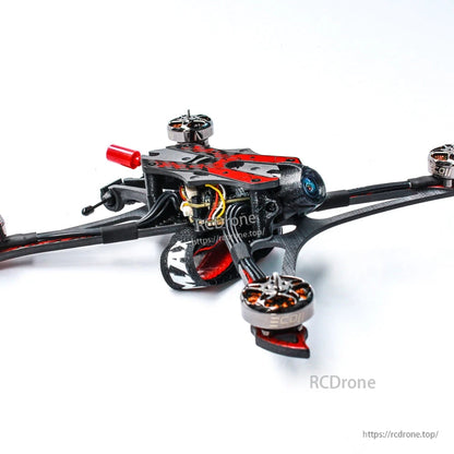 Front-left angle showing camera, battery strap, and motor layout on carbon-fiber frame