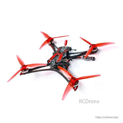 Top-down angled view of the quad frame with red props, exposed wiring, and battery lead