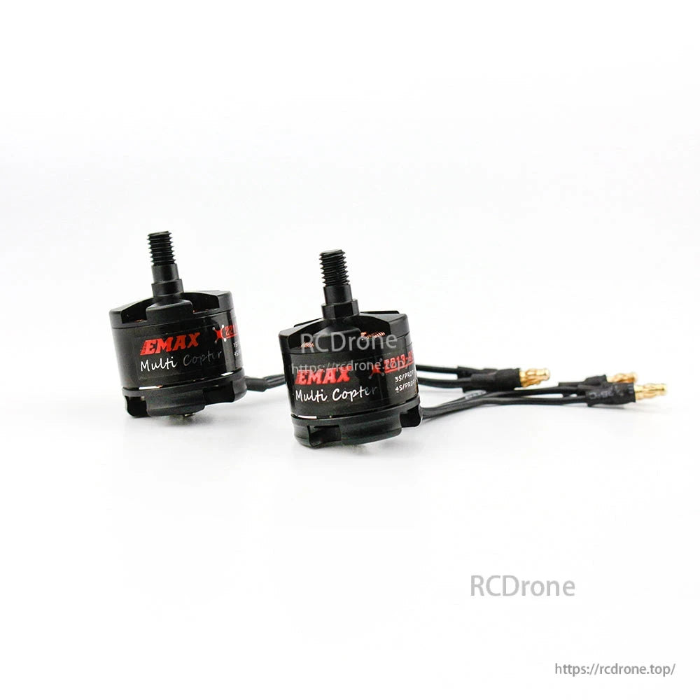 Two EMAX MT2213 series brushless motors shown together for size comparison, one with wires attached