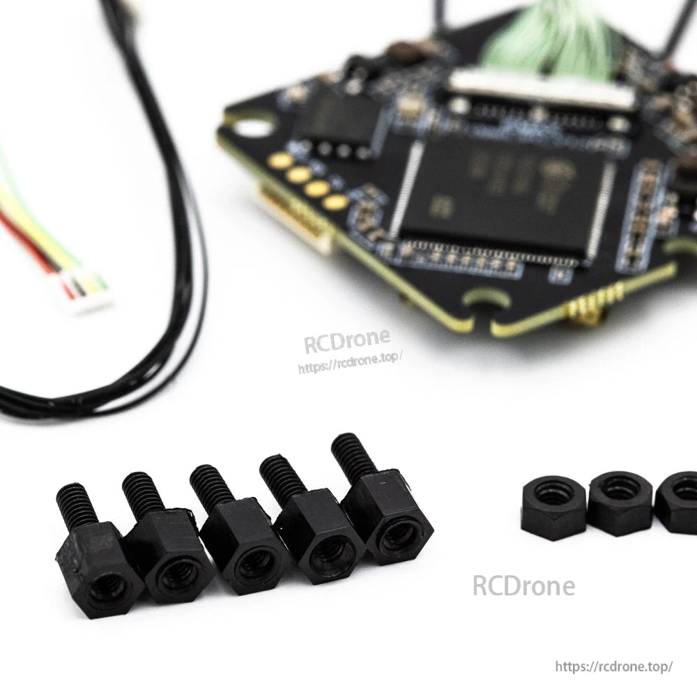 Mounting hardware close-up with black standoffs and nuts included with the VTX kit