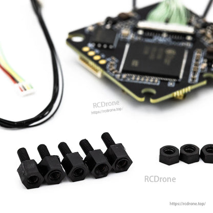 Mounting hardware close-up with black standoffs and nuts included with the VTX kit