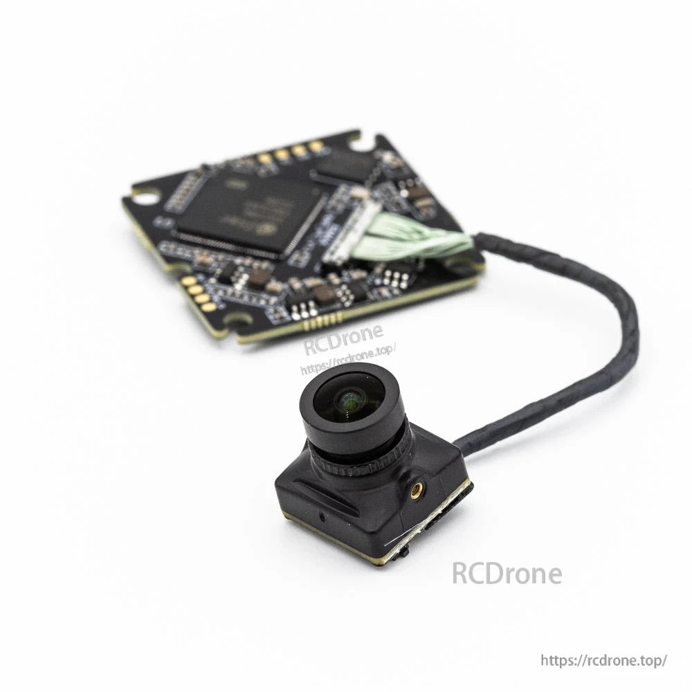 Camera lens front view with compact FPV camera housing and VTX board blurred behind