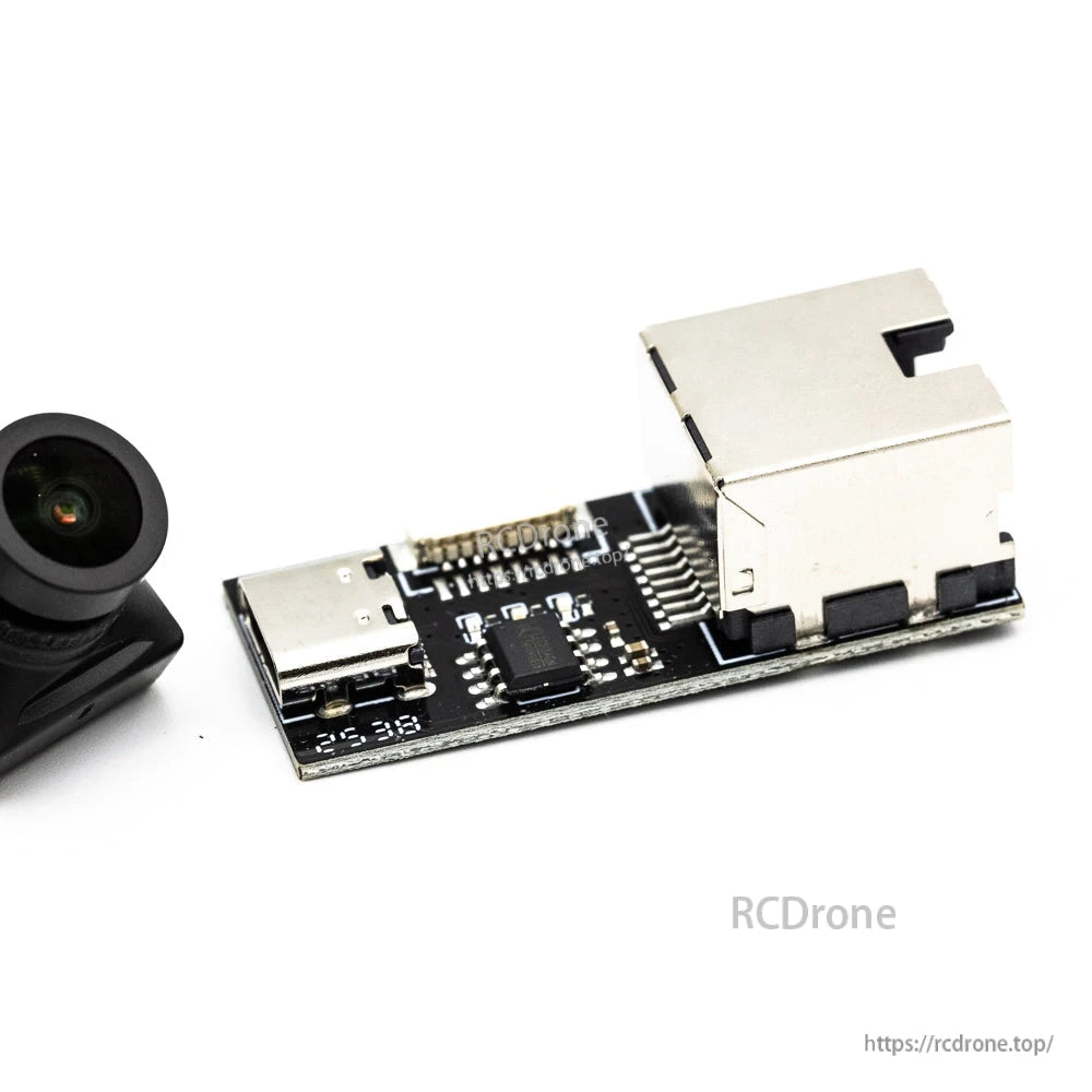 Interface board close-up showing USB-C port and microSD card slot next to the camera