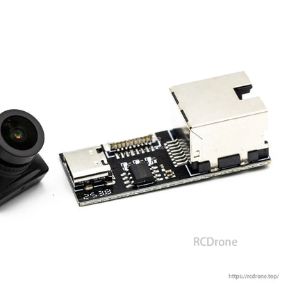 Interface board close-up showing USB-C port and microSD card slot next to the camera