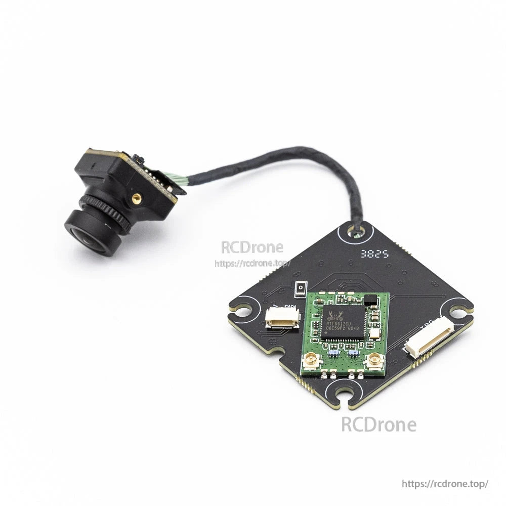Back view of VTX main board with small daughterboard and side connectors, camera attached