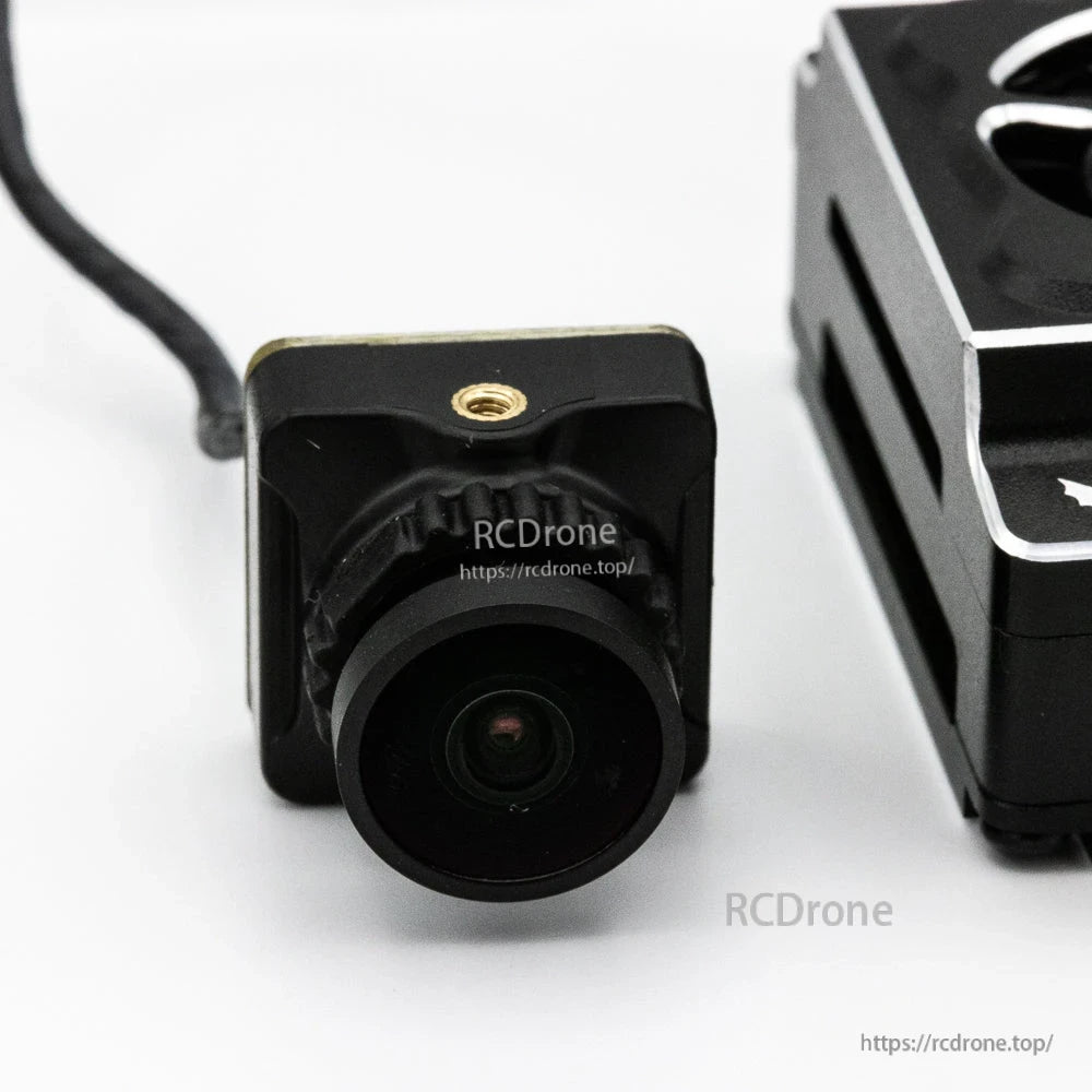 FPV camera front lens close-up from Wyvern Link kit showing square camera body and mounting point