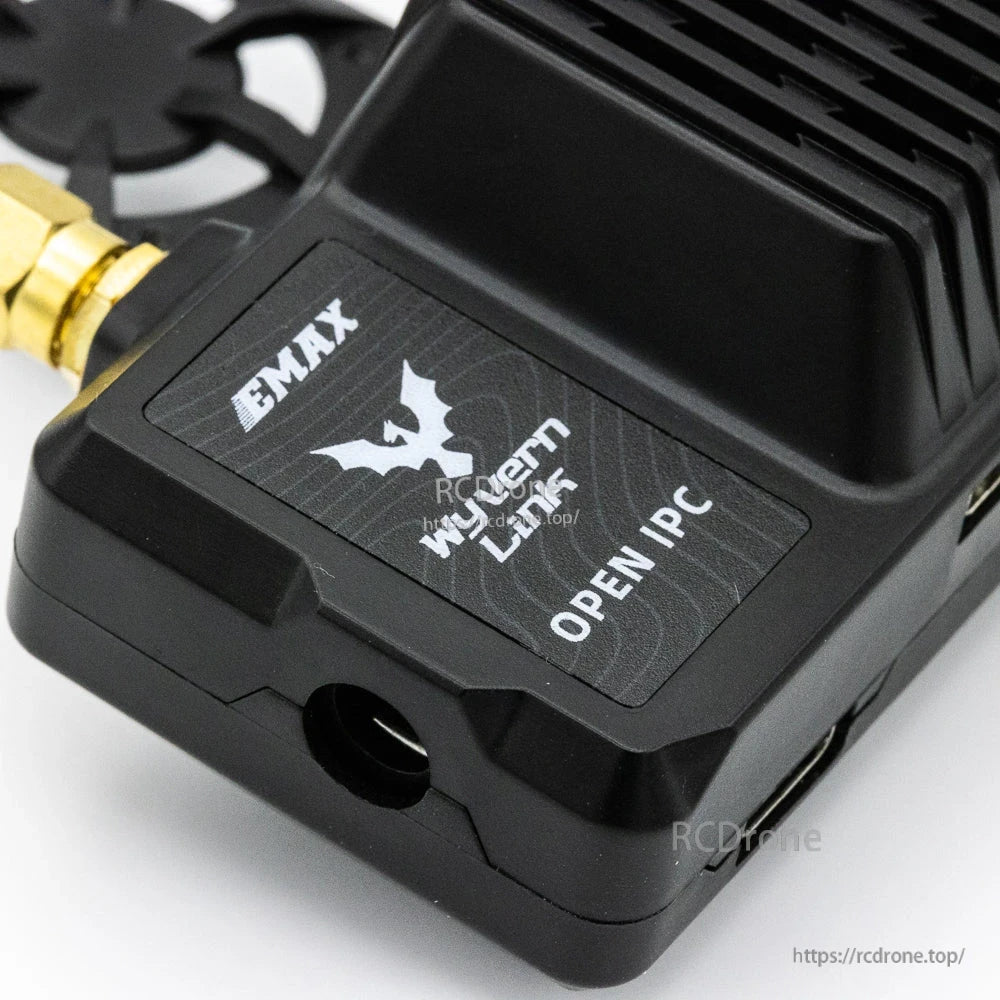 Logo label close-up on VRX housing showing EMAX Wyvern Link OpenIPC branding