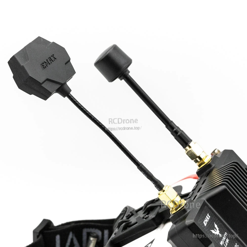 Antenna close-up showing flat patch antenna and stubby antenna on gold SMA connectors