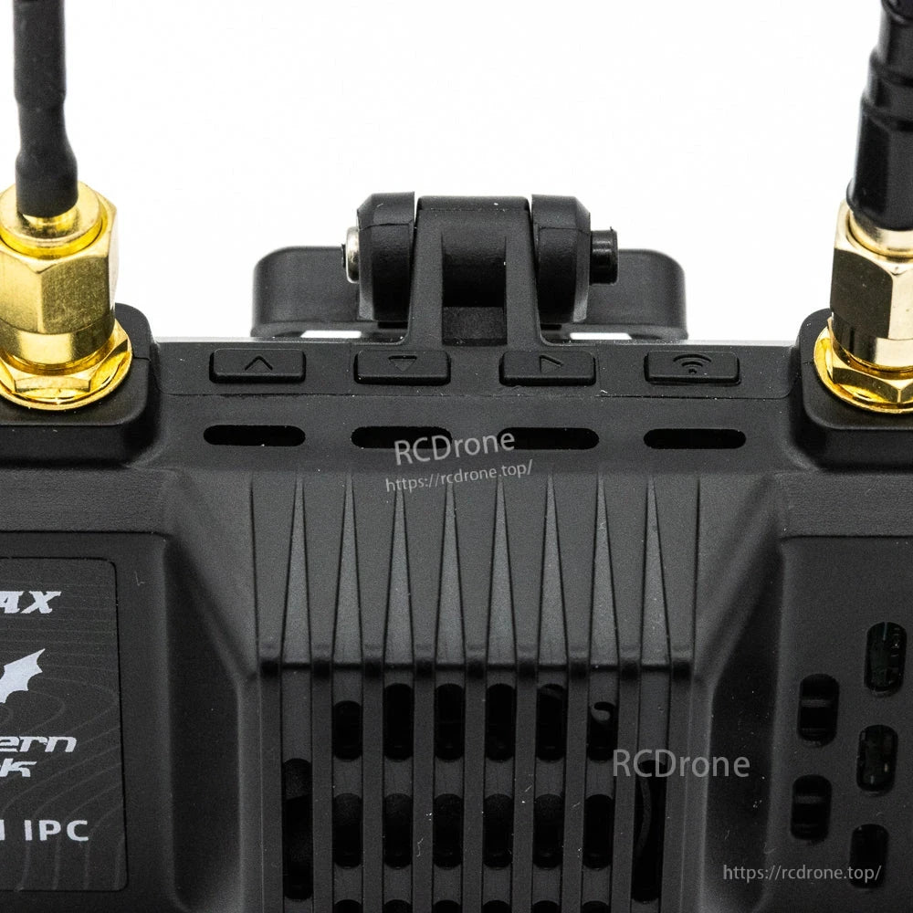 Top edge close-up of VRX showing mount hinge and control buttons along the housing