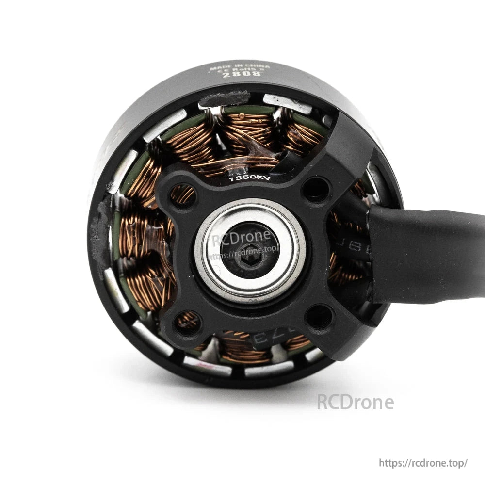 Bottom view of EMAX PRO Series PRO-2808 brushless motor showing mounting base, bearing, and 1350KV label