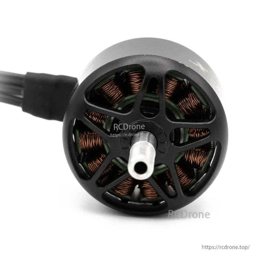 Front view into motor bell showing center shaft end and exposed copper stator windings
