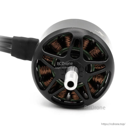 Front view into motor bell showing center shaft end and exposed copper stator windings