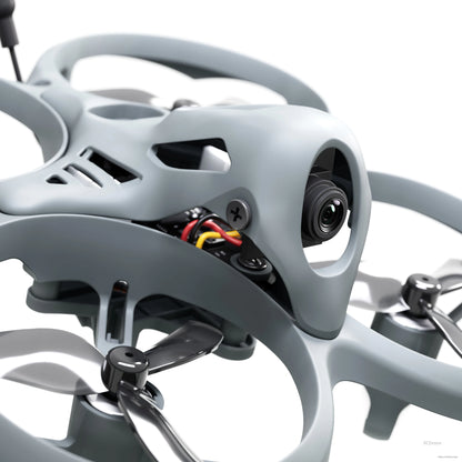 Close-up of Tinyhawk Lite FPV camera mounted in nose canopy with visible wiring and screws