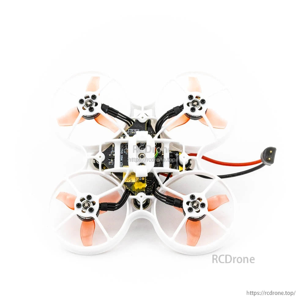Underside view of ducted quad showing motor mounts, frame structure, and bottom electronics