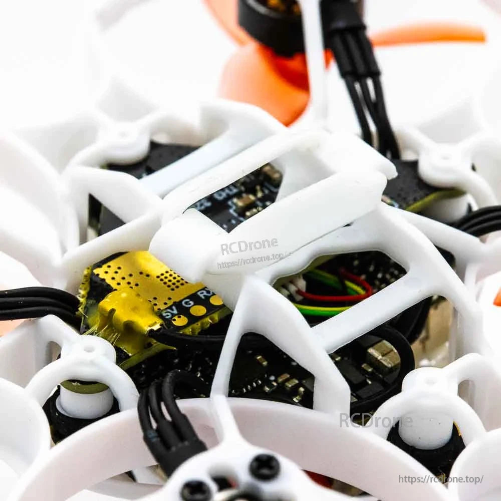 Close-up of internal electronics stack and wiring inside the whoop frame
