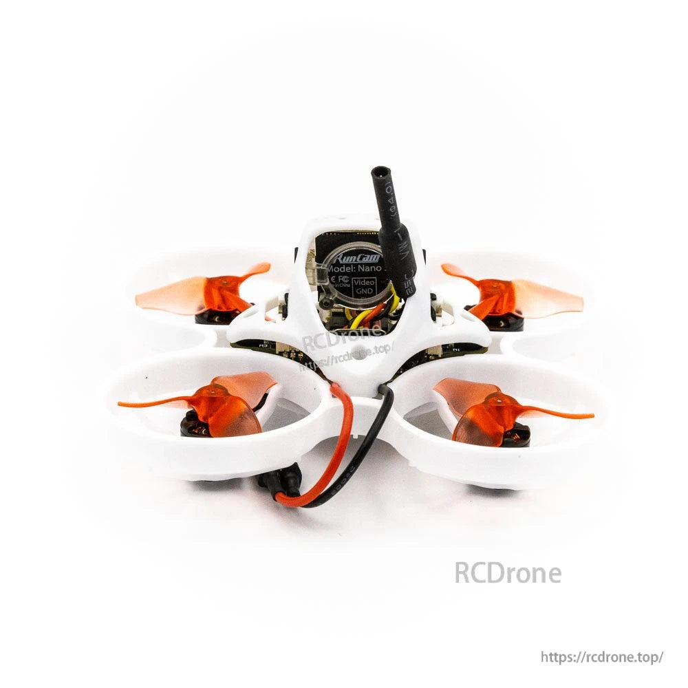 Micro whoop drone rear view showing antenna, wiring, and orange propellers in ducts