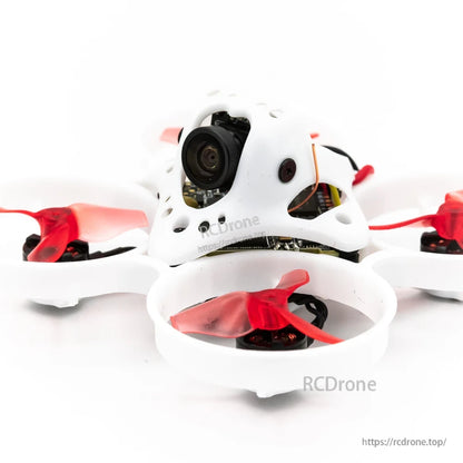 Side close-up of FPV camera canopy on Tinyhawk Nanoscout whoop drone with red prop guards