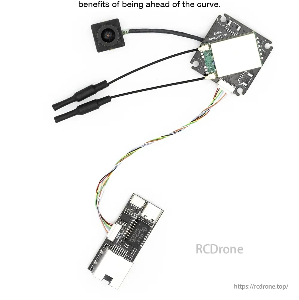 Wyvern Link receiver board with camera and cable harness connected to USB-C/Ethernet adapter for setup