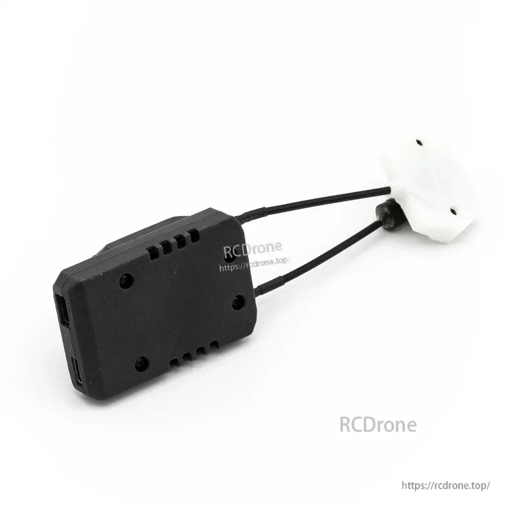Rear angle of receiver body showing mounting holes, vents, and attached antenna cables