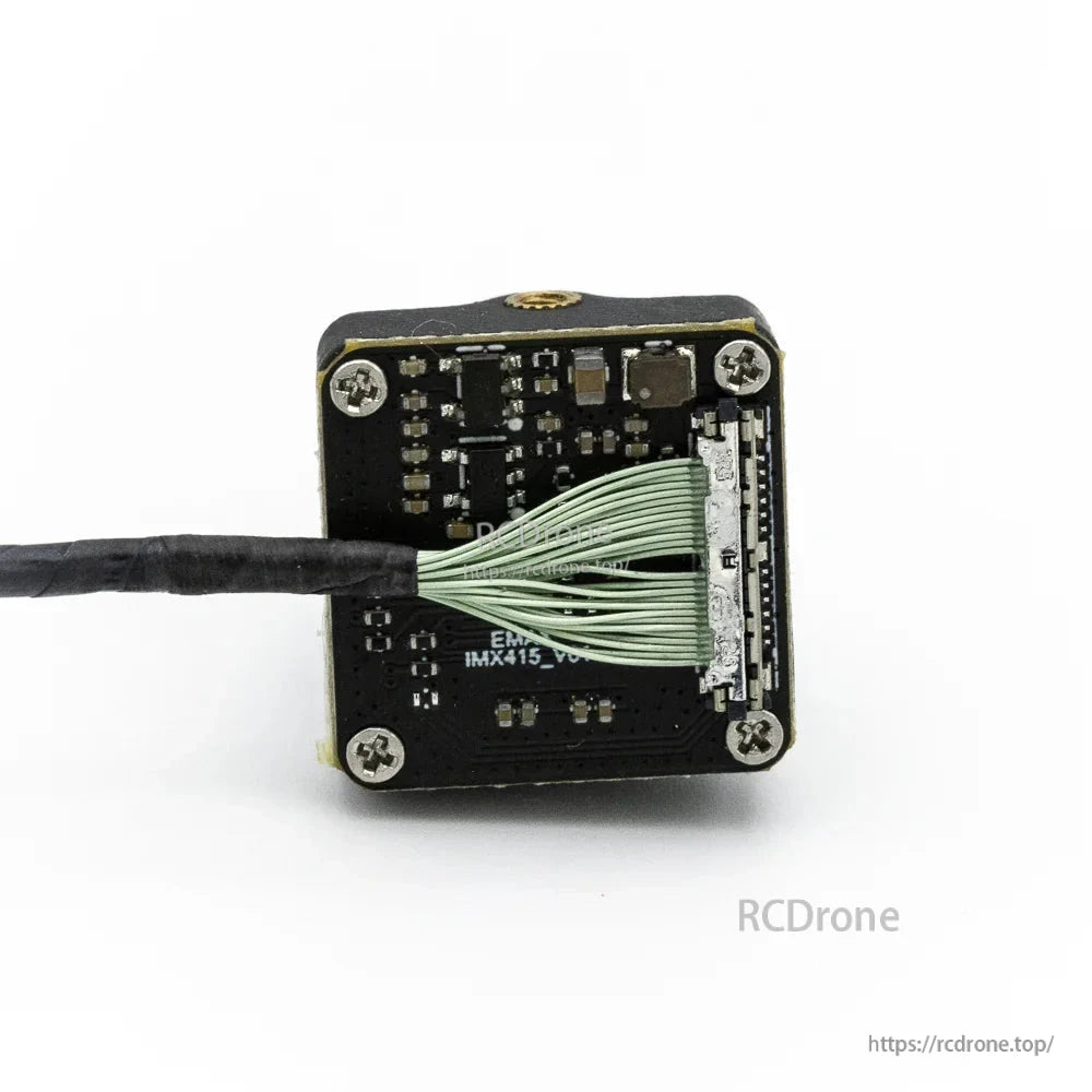 Back of FPV camera showing ribbon cable termination and connector detail on the camera PCB
