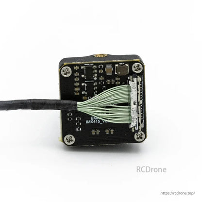 Back of FPV camera showing ribbon cable termination and connector detail on the camera PCB
