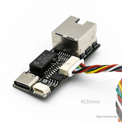 Close-up of USB‑C connector and pin header on the interface board next to RJ45-style jack