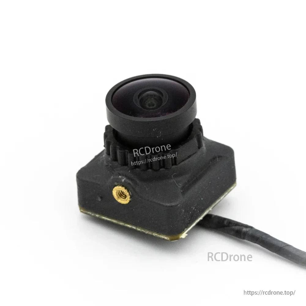 FPV camera module close-up with wide-angle lens and side mounting insert