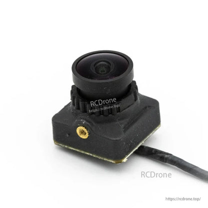FPV camera module close-up with wide-angle lens and side mounting insert