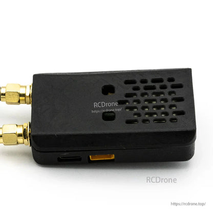 Rear/bottom view of receiver showing ventilation grid and port openings along the edge