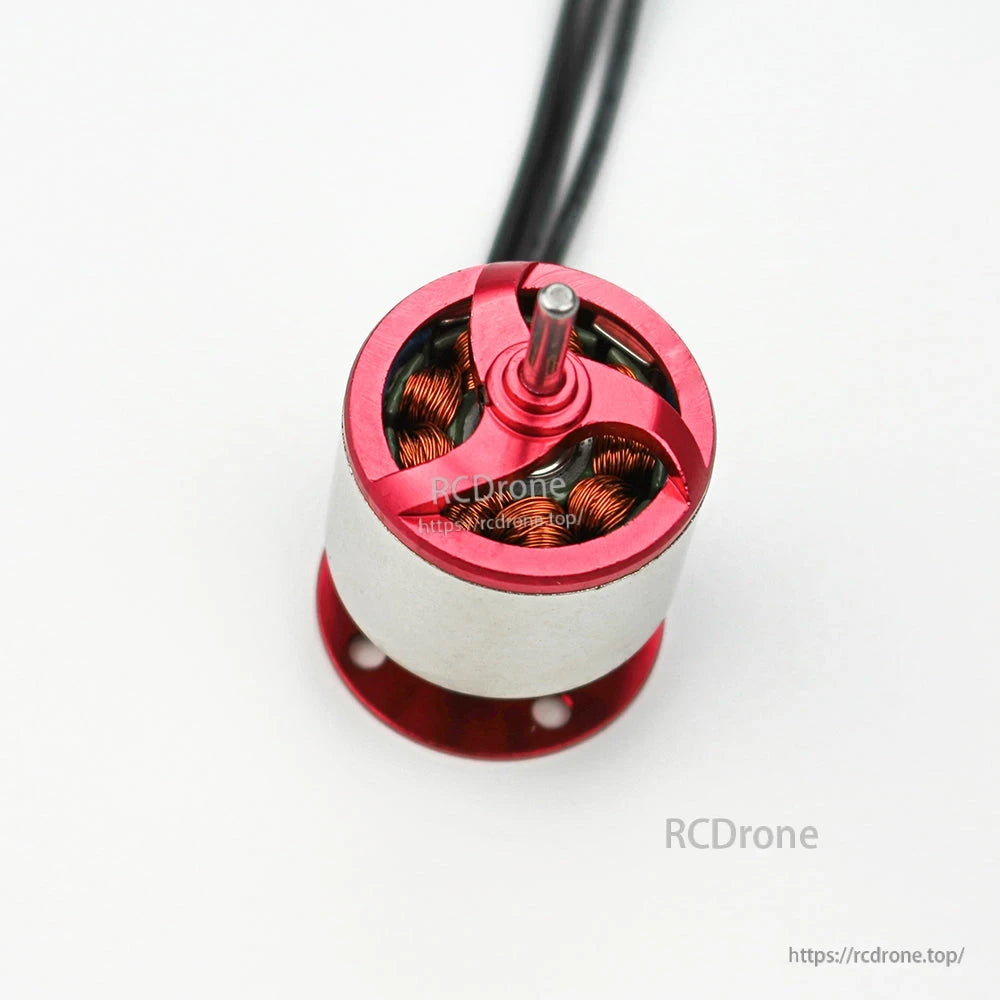 Top-down close-up of motor head showing prop shaft and copper windings inside the red housing