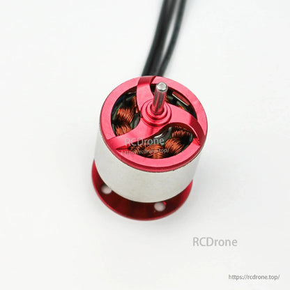 Top-down close-up of motor head showing prop shaft and copper windings inside the red housing