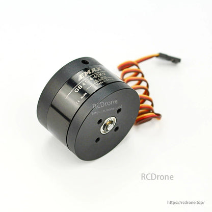 Angled underside view of motor highlighting center output shaft, mounting pattern, and wiring