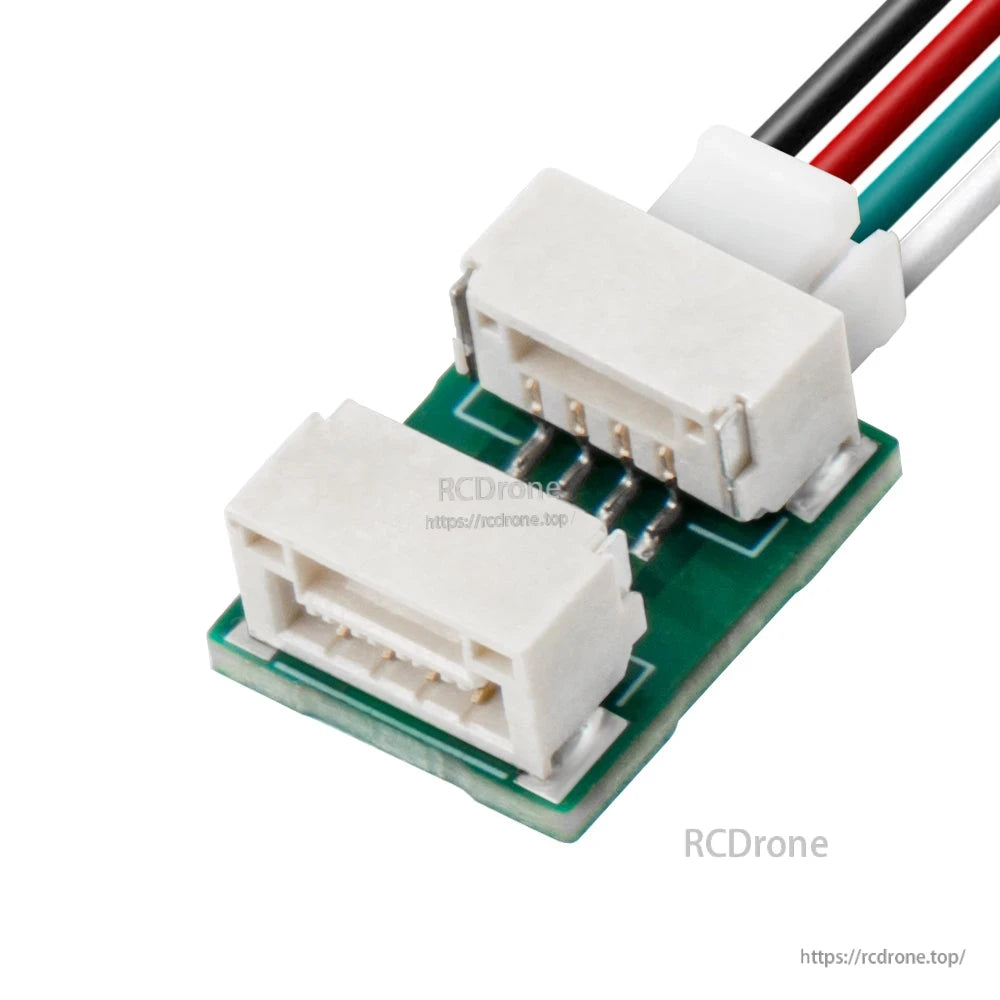 Angled view showing dual white connectors on the UART to dual PWM adapter with attached wires