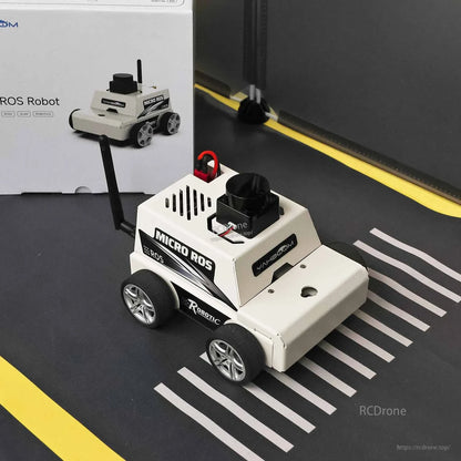 ESP32 MicroROS Robot car on test track with line markings, product box in background